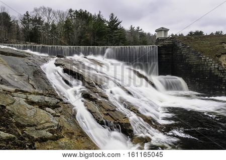 Water from Barden Reservoir spilling across rocky hillside