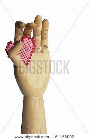 hand made of wood with red heart