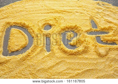 Word DIET written on cornflour background