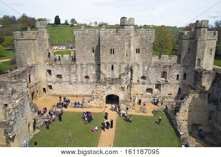 BODIAM, UK - 1 MAY, 2016:  Bodiam Castle 14th-century moated fortification with lots of tourists.