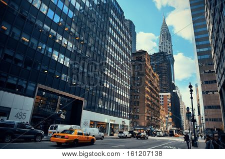 NEW YORK CITY - FEB 19: Street view with skyscrapers on February 19, 2014 in Manhattan, New York City. With population of 8.4M, it is the most populous city in the United States.  