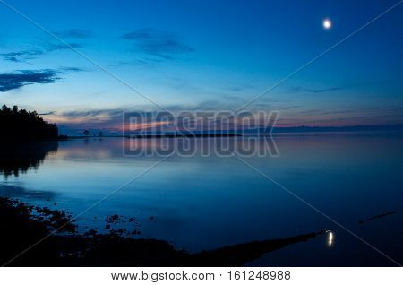 moonrise over Lake Baikal near rock Small Bell Tower, Sandy bay