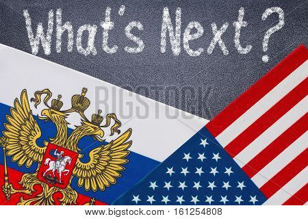 What's next hand writing chalk text on black chalkboard