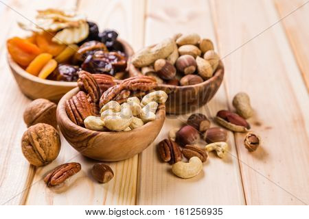 Selection of dried fruits and nuts as symbols of Tu Bishvat, copy space