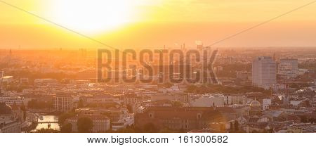 Beautiful panoramic aerial view over Berlin, Germany, in romantic colorful sunset.