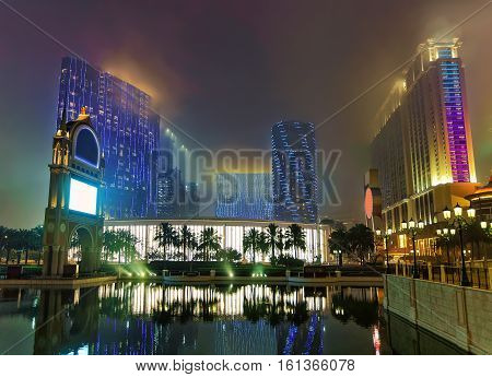 Macao China - March 8 2016: Hotel and Canal of Macau Casino and Hotel luxury resort in Macao China. Late in the evening. Golden light illumination