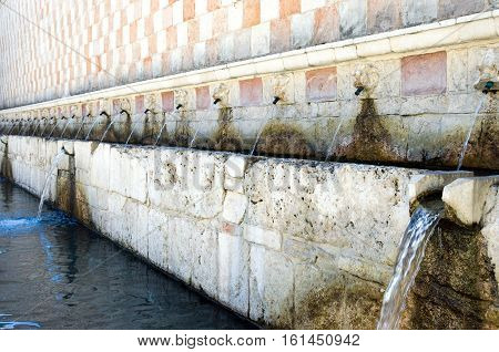Italy L'Aquila the Novantanove Cannelle fountain (XIII-XVI century)