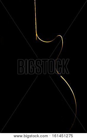 Electric Guitar Gold Silhouette On A Black Background