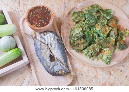 Fried acacia pennata omelet with sauce of shrimp paste and chili (Nam prik kapi) and fried mackerel Thai Cuisine