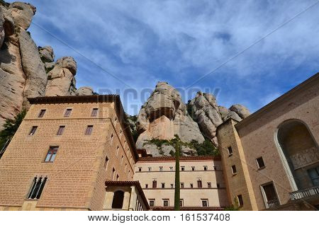 The Benedictine Monastery of Montserrat (Monasterio de Montserrat) is a recognized landmark in Spain. Today the monastery is the spiritual centre of Catalonia and a place of pilgrimage. Located Montserrat Monastery high in the mountains