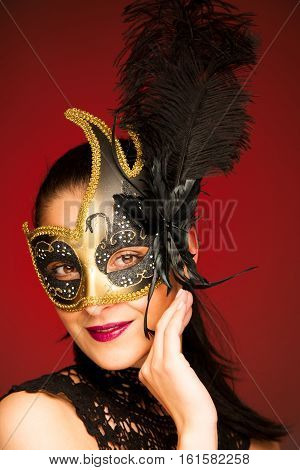 Elegant Woman With Venice Mask Over Stilish Red Background - Carnival