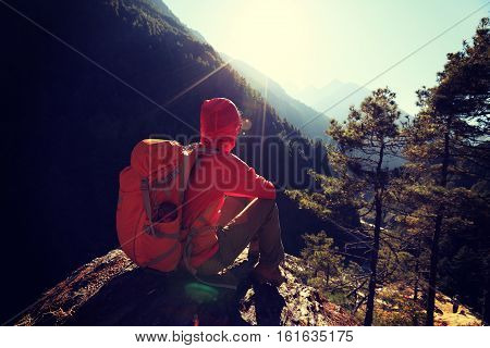 young woman backpacker enjoy the sunrise at the himalaya mountains