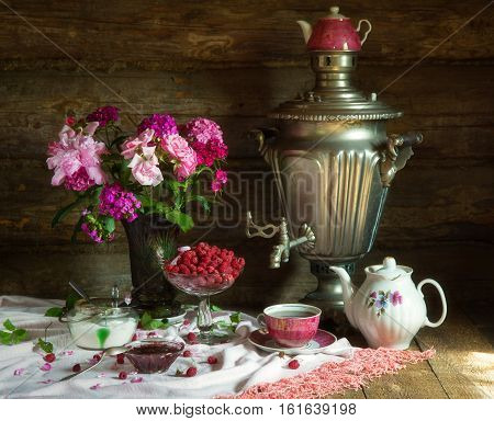Tea Party in rustic style with samovar raspberry and jam