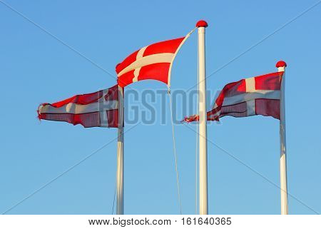 Danish Flag Dannebrog against clear blue sky