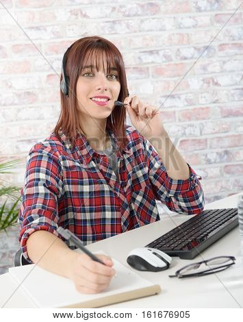 cheerful beautiful young support phone operator with headset