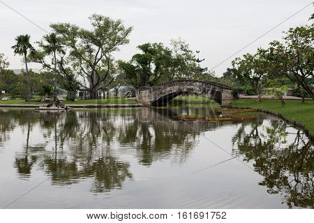 concrete bridge and lagoon in public park Suan luang Rama 9 park Bangkok Thailand.