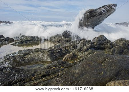 Wave Splashing Over Rocks