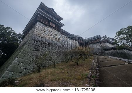 walkway to matsuyama castle on a grey day