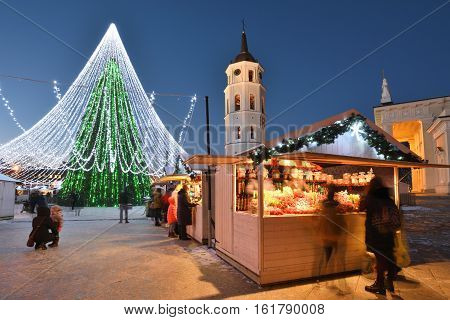 VILNIUS LITHUANIA - NOVEMBER 28: Night view of the christmas tree in Vilnius on November 28 2016 in Vilnius Lithuania. In 1994 the Vilnius Old Town was included in the UNESCO World Heritage List.