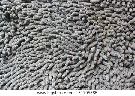 The grey mat surface is made from a microfibre.