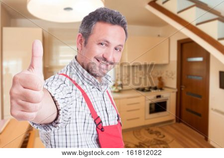 Closeup Portrait Of Male Fitter Showing Thumbup Sign