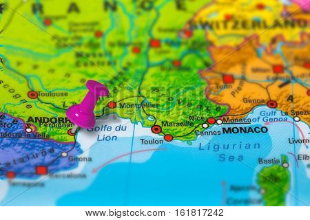 perpignan in France pinned on colorful political map of Europe. Geopolitical school atlas. Tilt shift effect.
