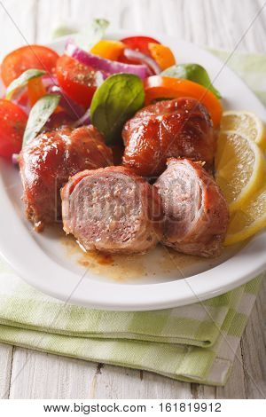 Roasted Rabbit Fillet Roulade And Vegetable Salad Close-up. Vertical