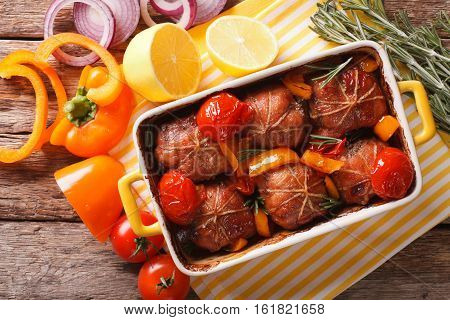 Roll Of Rabbit Baked With Tomato And Pepper In Baking Dish. Horizontal Top View