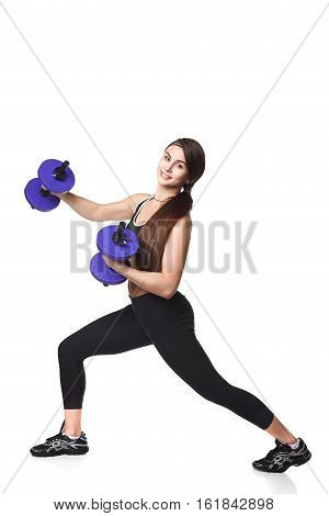 Athletic fitness woman helthy sport isolated white background young female health muscles copy space black clothes smilling attractive beautyful stretch activity copy space empty dumbbells