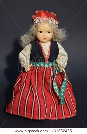 Old or antique doll in estonian national costume