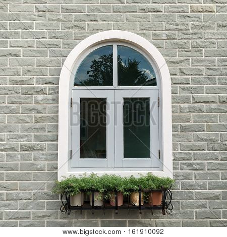 European style window with brick wall background