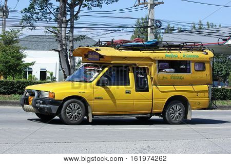 CHIANG MAI THAILAND - OCTOBER 31 2016: Yellow mini truck taxi chiangmai Service between city and Maejam Subdistrict. Photo at road no 121 about 8 km from downtown Chiangmai thailand.