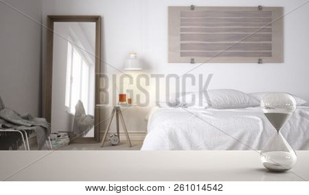 White Table Or Shelf With Crystal Hourglass Measuring The Passing Time Over Modern Bedroom With Doub