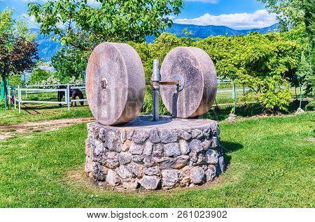 Ancient Olive Press With Two Millstones In The Countryside