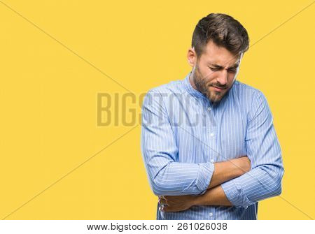 Young handsome man over isolated background with hand on stomach because nausea, painful disease feeling unwell. Ache concept.