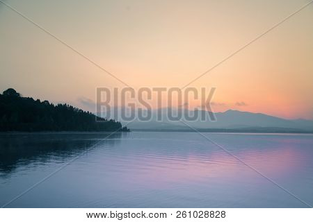 A Dreamy, Hazy Landscape Of A Mountains Close To Sunset. Sun Flase And Misty Look In Blue Tones. Mo