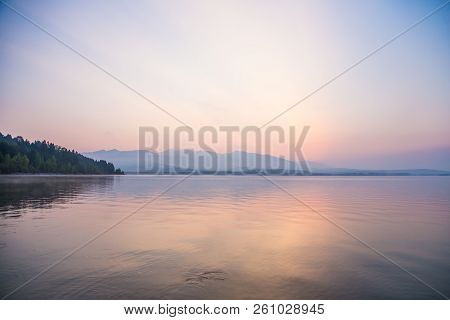 A Dreamy, Hazy Landscape Of A Mountains Close To Sunset. Sun Flase And Misty Look In Blue Tones. Mo