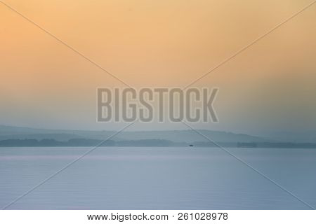 A Dreamy, Hazy Landscape Of A Mountains Close To Sunset. Sun Flase And Misty Look In Blue Tones. Mo
