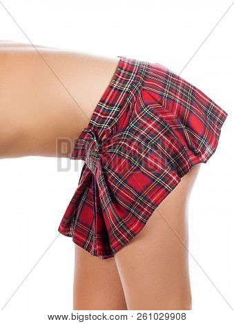 Buttocks Of Young Woman In Red Tarten Plaid Mini Skirt