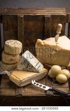 Parmesan, Taleggio, Caciotta And Asolo Cheese On Dark Wooden Table