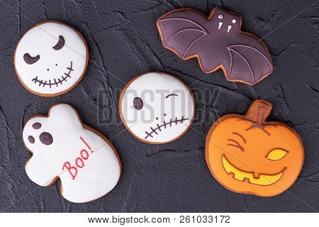 Assorted Halloween Cookies On Black Slate. Homemade Gingerbread Biscuits Including Bat, Ghost, Pumpk