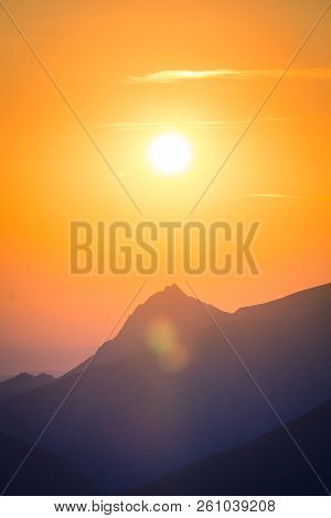 A Beautiful, Colorful, Abstract Mountain Scenery In Sunrise. Minimalist Landscape Of Mountains In Mo