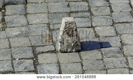 Typical Pavement Of The Streets Of Rome With Cobblestone (sanpietrini). In View Of One Of The Stone 