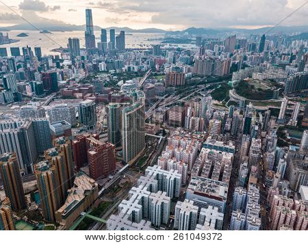 Top view aerial photo from flying drone of a HongKong Global City with development buildings, transportation, energy power infrastructure. Financial and business centers in developed China town