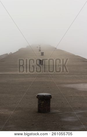 A Pier On Lake Michigan Obscured By Thick Fog.  Sheboygan, Wisconsin, Usa.