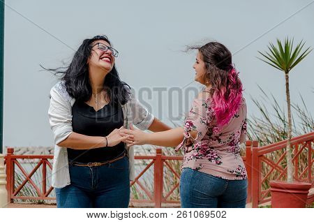 Two Chubby Girls With Inline Skates In The Park