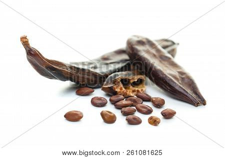 Carob On White Background. Organic Carob Pods With Seeds