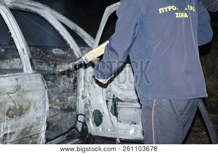 Athnes City Acharne 1 October 2018 Firefighter Douses A Fire During, Fire Suppression On Car Reservo