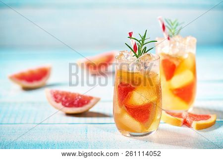 Ripened Grapefruit And Fresh Rosemary To Prepare A Refreshing Su