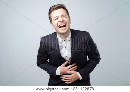 Handsome European Man In Suit, Laughing. Positive Emotion Concept